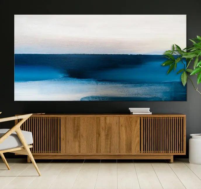 The living room is enhanced by the Dark Blue Abstract Wall Art Canvas Print, a triptych painting on hand-assembled framed canvas with UV-protective coating for enduring vibrancy.