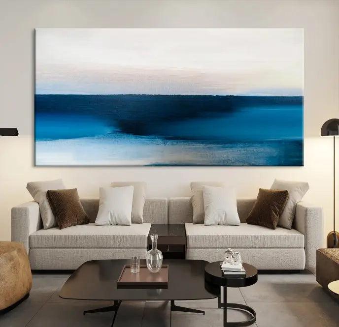 The living room is enhanced by the Dark Blue Abstract Wall Art Canvas Print, a triptych painting on hand-assembled framed canvas with UV-protective coating for enduring vibrancy.