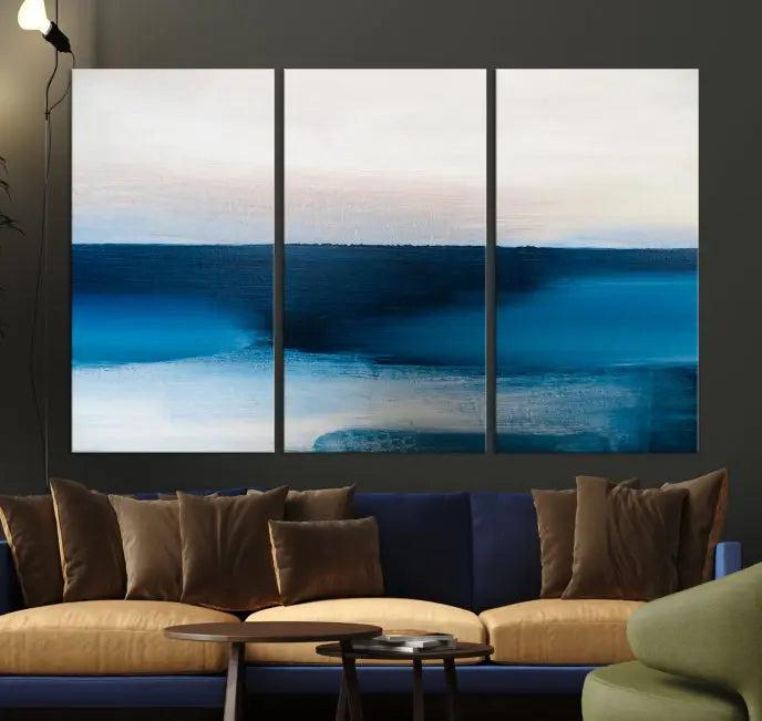 The living room is enhanced by the Dark Blue Abstract Wall Art Canvas Print, a triptych painting on hand-assembled framed canvas with UV-protective coating for enduring vibrancy.