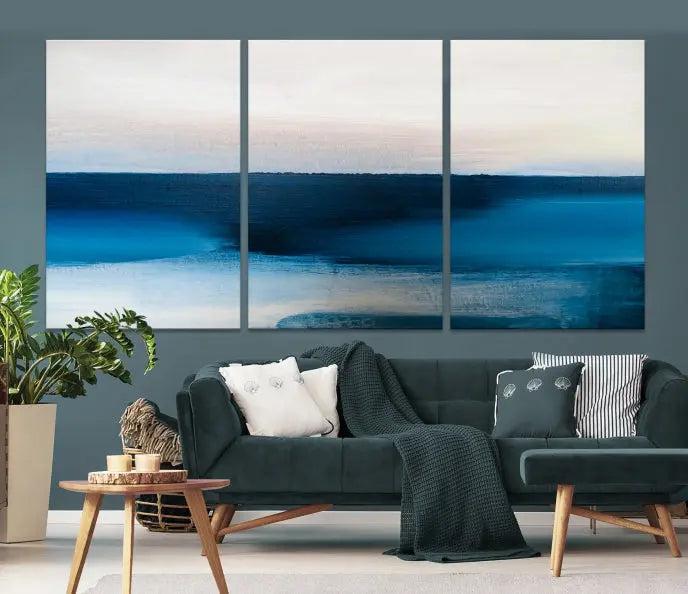 The living room is enhanced by the Dark Blue Abstract Wall Art Canvas Print, a triptych painting on hand-assembled framed canvas with UV-protective coating for enduring vibrancy.