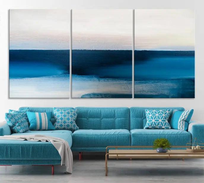 The living room is enhanced by the Dark Blue Abstract Wall Art Canvas Print, a triptych painting on hand-assembled framed canvas with UV-protective coating for enduring vibrancy.