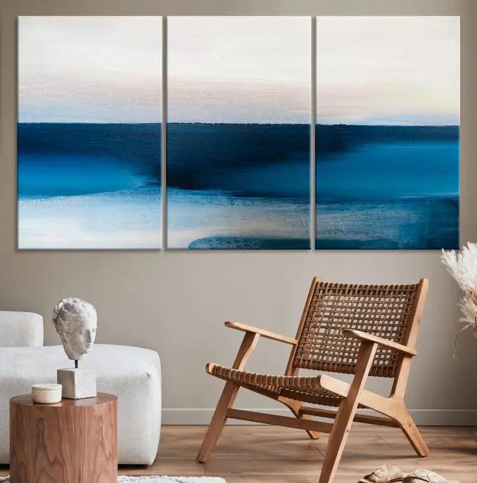 The living room is enhanced by the Dark Blue Abstract Wall Art Canvas Print, a triptych painting on hand-assembled framed canvas with UV-protective coating for enduring vibrancy.