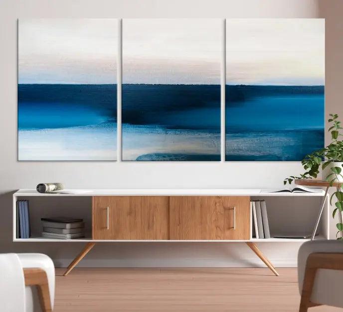 The living room is enhanced by the Dark Blue Abstract Wall Art Canvas Print, a triptych painting on hand-assembled framed canvas with UV-protective coating for enduring vibrancy.