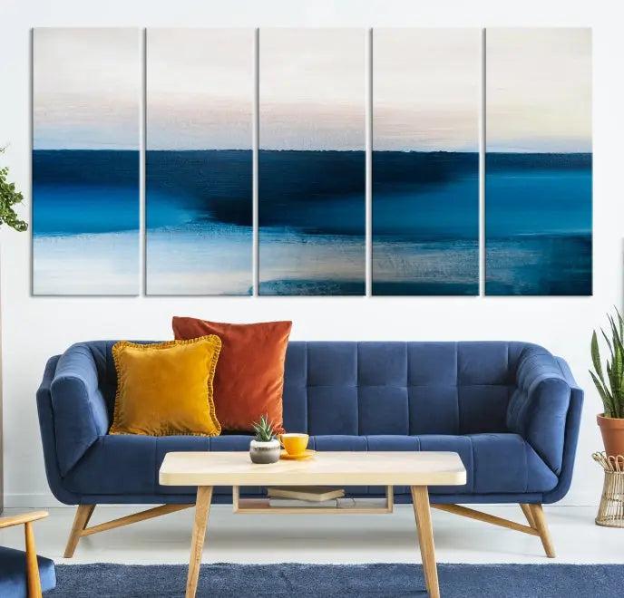 The living room is enhanced by the Dark Blue Abstract Wall Art Canvas Print, a triptych painting on hand-assembled framed canvas with UV-protective coating for enduring vibrancy.