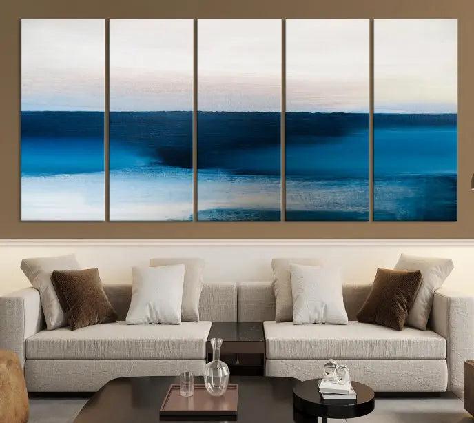 The living room is enhanced by the Dark Blue Abstract Wall Art Canvas Print, a triptych painting on hand-assembled framed canvas with UV-protective coating for enduring vibrancy.