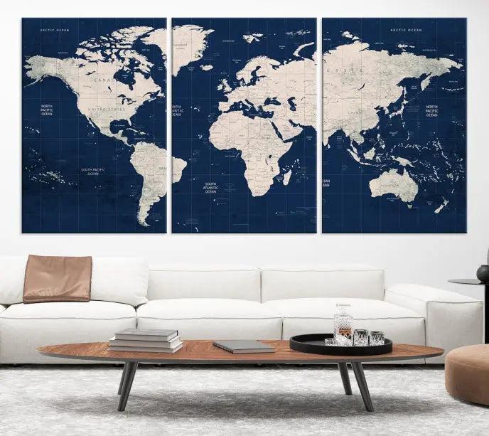 The modern living room is beautifully accented by the Dark Blue World Map Wall Art Canvas Print. This gallery-wrapped triptych features a dark blue backdrop that adds depth, creating a canvas of elegance on the wall.