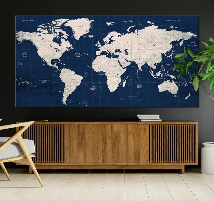 The modern living room is beautifully accented by the Dark Blue World Map Wall Art Canvas Print. This gallery-wrapped triptych features a dark blue backdrop that adds depth, creating a canvas of elegance on the wall.