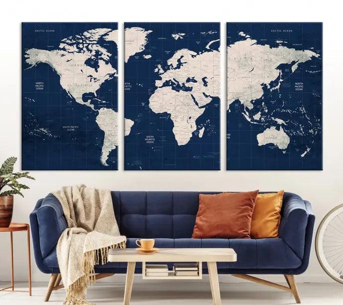 The modern living room is beautifully accented by the Dark Blue World Map Wall Art Canvas Print. This gallery-wrapped triptych features a dark blue backdrop that adds depth, creating a canvas of elegance on the wall.