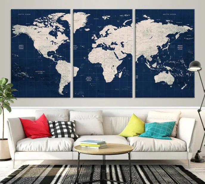 The modern living room is beautifully accented by the Dark Blue World Map Wall Art Canvas Print. This gallery-wrapped triptych features a dark blue backdrop that adds depth, creating a canvas of elegance on the wall.