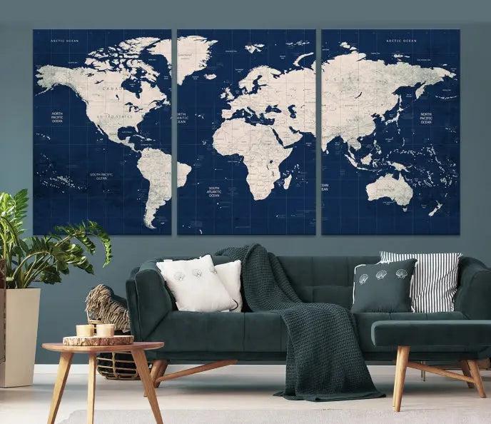 The modern living room is beautifully accented by the Dark Blue World Map Wall Art Canvas Print. This gallery-wrapped triptych features a dark blue backdrop that adds depth, creating a canvas of elegance on the wall.