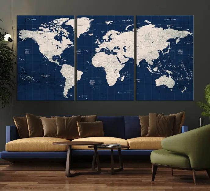 The modern living room is beautifully accented by the Dark Blue World Map Wall Art Canvas Print. This gallery-wrapped triptych features a dark blue backdrop that adds depth, creating a canvas of elegance on the wall.