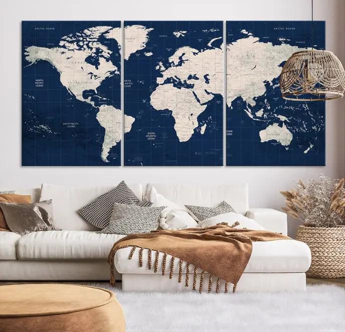 The modern living room is beautifully accented by the Dark Blue World Map Wall Art Canvas Print. This gallery-wrapped triptych features a dark blue backdrop that adds depth, creating a canvas of elegance on the wall.