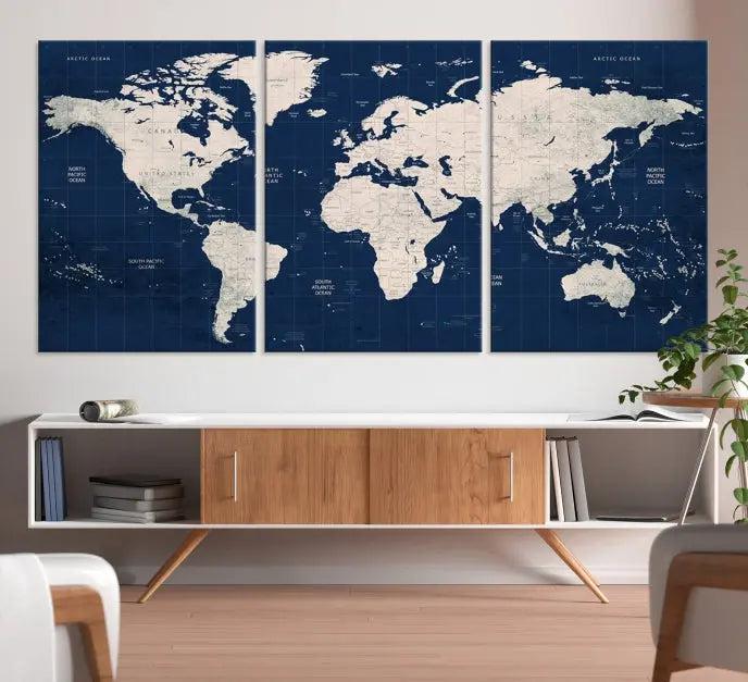 The modern living room is beautifully accented by the Dark Blue World Map Wall Art Canvas Print. This gallery-wrapped triptych features a dark blue backdrop that adds depth, creating a canvas of elegance on the wall.