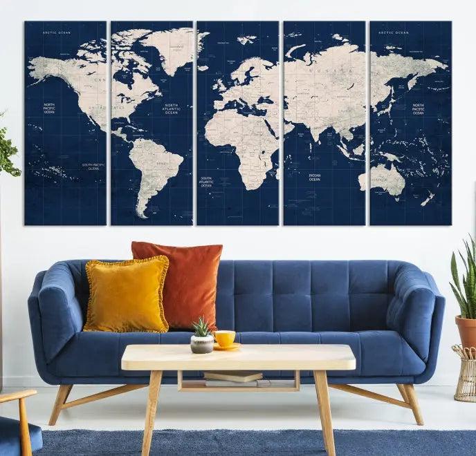 The modern living room is beautifully accented by the Dark Blue World Map Wall Art Canvas Print. This gallery-wrapped triptych features a dark blue backdrop that adds depth, creating a canvas of elegance on the wall.