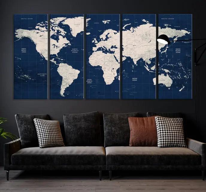 The modern living room is beautifully accented by the Dark Blue World Map Wall Art Canvas Print. This gallery-wrapped triptych features a dark blue backdrop that adds depth, creating a canvas of elegance on the wall.