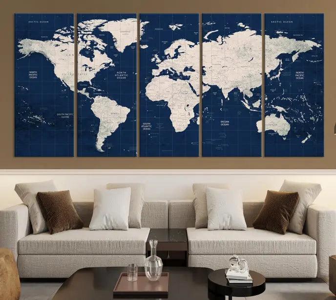 The modern living room is beautifully accented by the Dark Blue World Map Wall Art Canvas Print. This gallery-wrapped triptych features a dark blue backdrop that adds depth, creating a canvas of elegance on the wall.