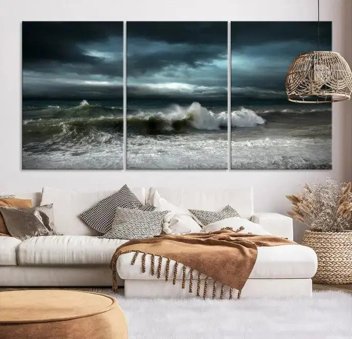 The Dark Storm Wall Art Canvas Print, featuring a breathtaking triptych of ocean waves, is expertly presented with gallery-wrapped edges and a UV-protective coating. It serves as a captivating centerpiece in this inviting living room.