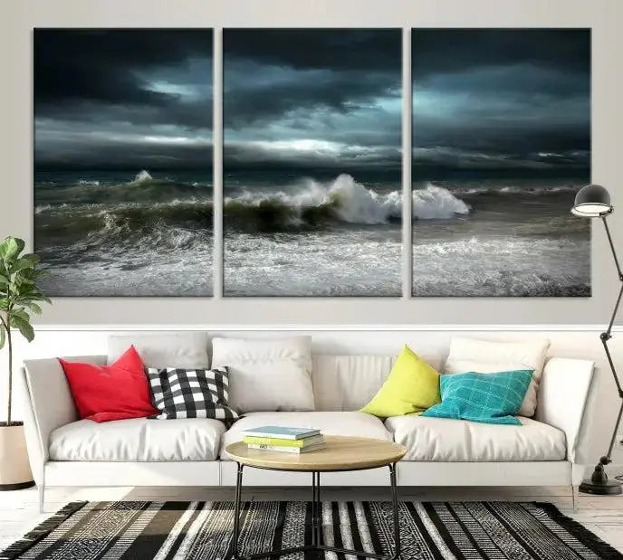 The Dark Storm Wall Art Canvas Print, featuring a breathtaking triptych of ocean waves, is expertly presented with gallery-wrapped edges and a UV-protective coating. It serves as a captivating centerpiece in this inviting living room.