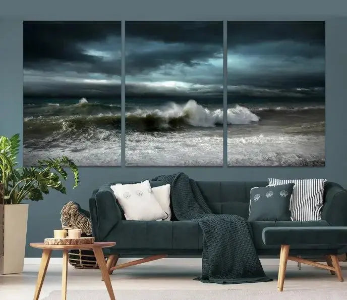 The Dark Storm Wall Art Canvas Print, featuring a breathtaking triptych of ocean waves, is expertly presented with gallery-wrapped edges and a UV-protective coating. It serves as a captivating centerpiece in this inviting living room.