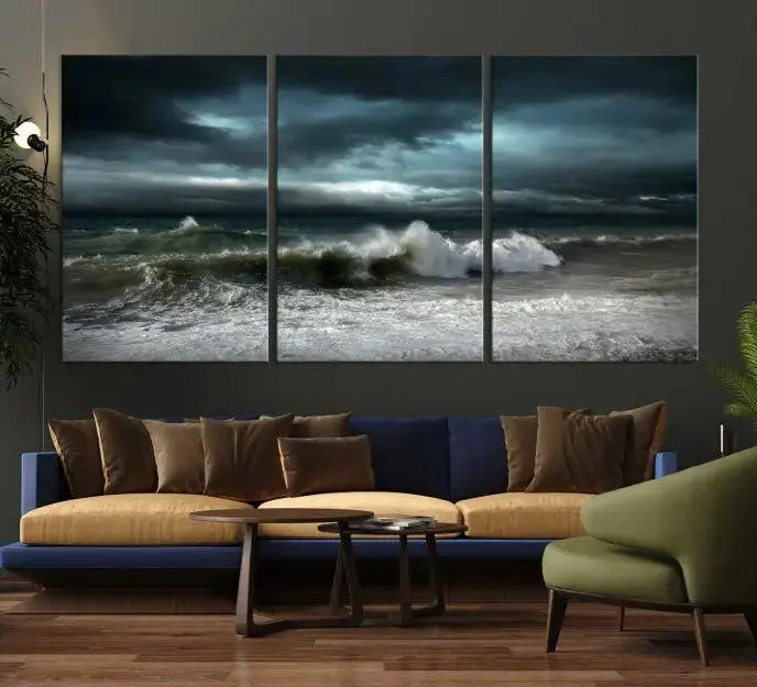 The Dark Storm Wall Art Canvas Print, featuring a breathtaking triptych of ocean waves, is expertly presented with gallery-wrapped edges and a UV-protective coating. It serves as a captivating centerpiece in this inviting living room.