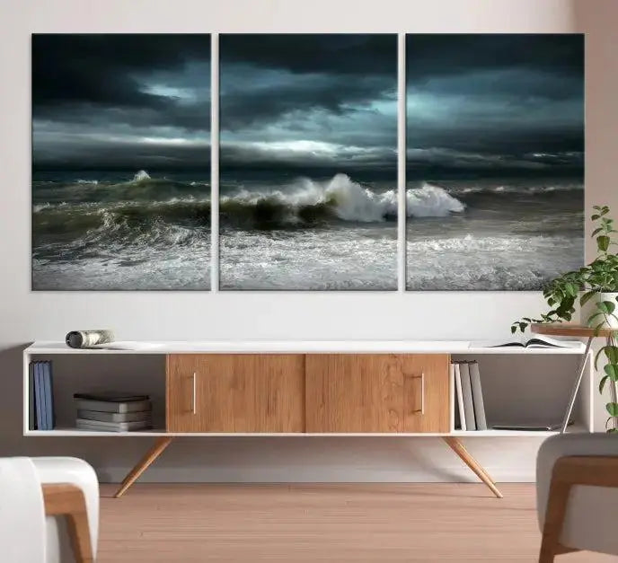 The Dark Storm Wall Art Canvas Print, featuring a breathtaking triptych of ocean waves, is expertly presented with gallery-wrapped edges and a UV-protective coating. It serves as a captivating centerpiece in this inviting living room.