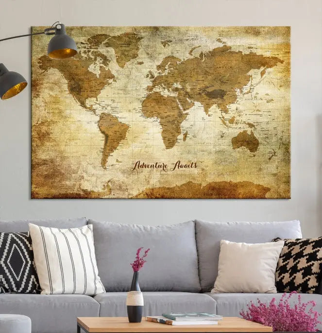 A Dark Theme World Map wall art canvas print, featuring the inspiring text "Adventure Awaits," hangs in this modern room. The map is crafted from museum-quality canvas and coated for UV protection, making it ready to hang.