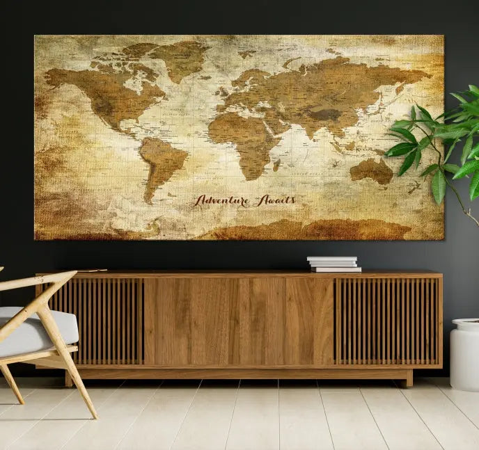 A Dark Theme World Map wall art canvas print, featuring the inspiring text "Adventure Awaits," hangs in this modern room. The map is crafted from museum-quality canvas and coated for UV protection, making it ready to hang.