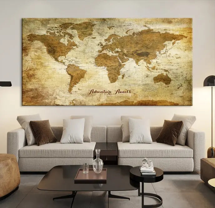 A Dark Theme World Map wall art canvas print, featuring the inspiring text "Adventure Awaits," hangs in this modern room. The map is crafted from museum-quality canvas and coated for UV protection, making it ready to hang.