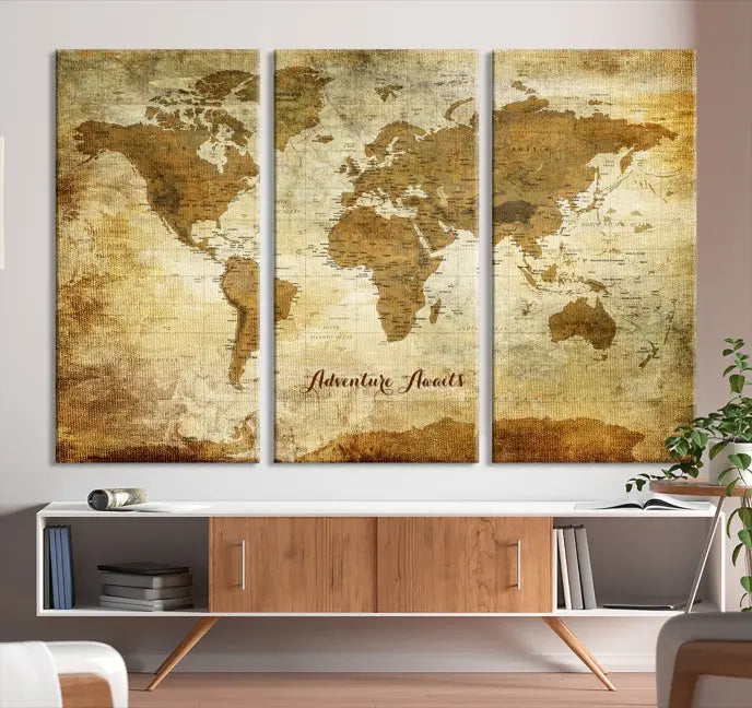 A Dark Theme World Map wall art canvas print, featuring the inspiring text "Adventure Awaits," hangs in this modern room. The map is crafted from museum-quality canvas and coated for UV protection, making it ready to hang.