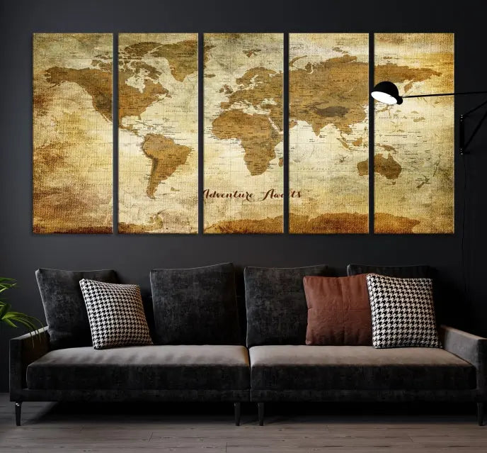 A Dark Theme World Map wall art canvas print, featuring the inspiring text "Adventure Awaits," hangs in this modern room. The map is crafted from museum-quality canvas and coated for UV protection, making it ready to hang.