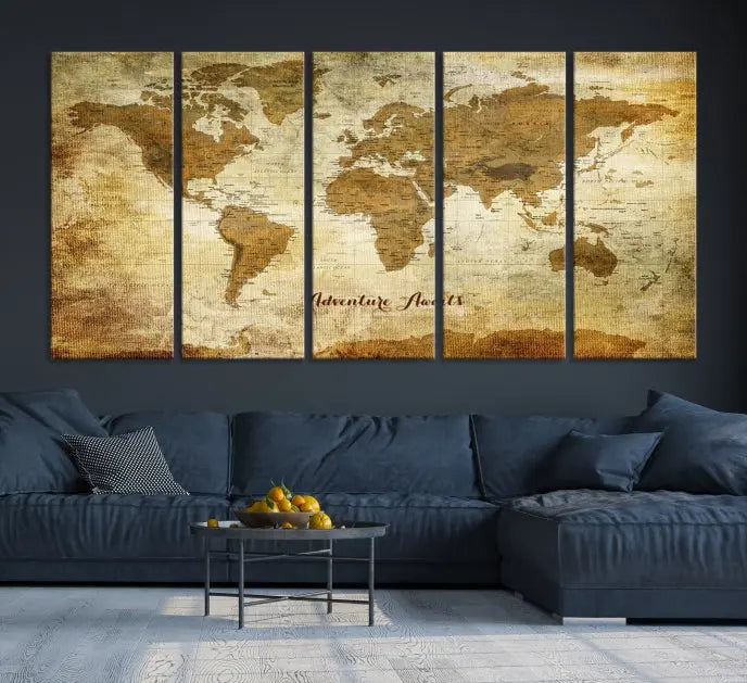 A Dark Theme World Map wall art canvas print, featuring the inspiring text "Adventure Awaits," hangs in this modern room. The map is crafted from museum-quality canvas and coated for UV protection, making it ready to hang.