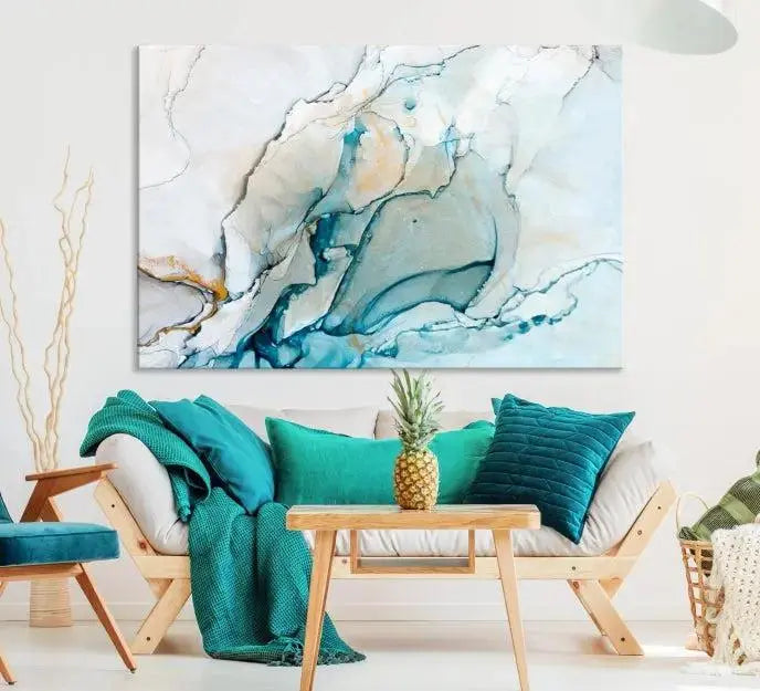 An abstract triptych of the Dark Turquoise Marble Fluid Effect on museum-quality canvas enhances the living room.