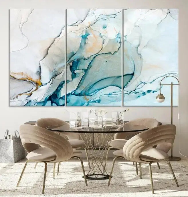 An abstract triptych of the Dark Turquoise Marble Fluid Effect on museum-quality canvas enhances the living room.