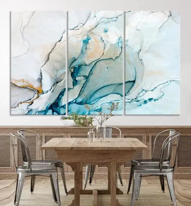 An abstract triptych of the Dark Turquoise Marble Fluid Effect on museum-quality canvas enhances the living room.