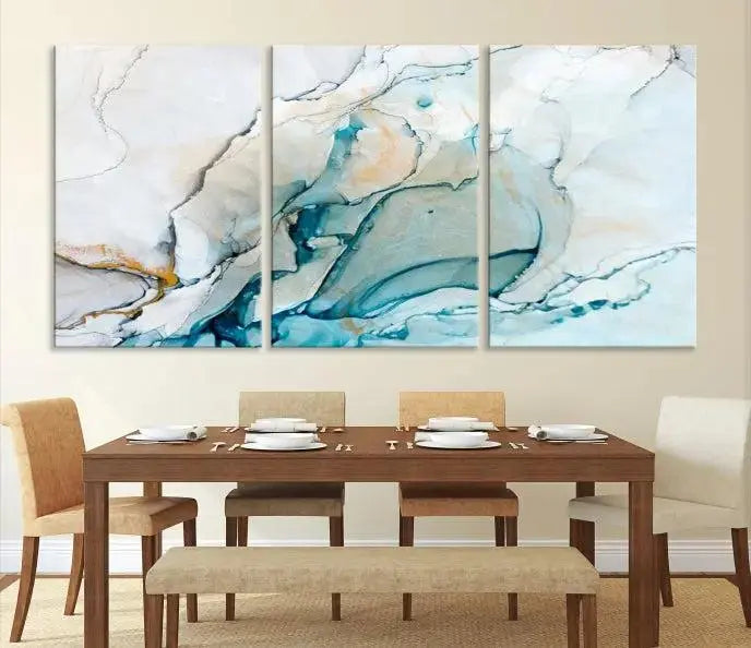 An abstract triptych of the Dark Turquoise Marble Fluid Effect on museum-quality canvas enhances the living room.