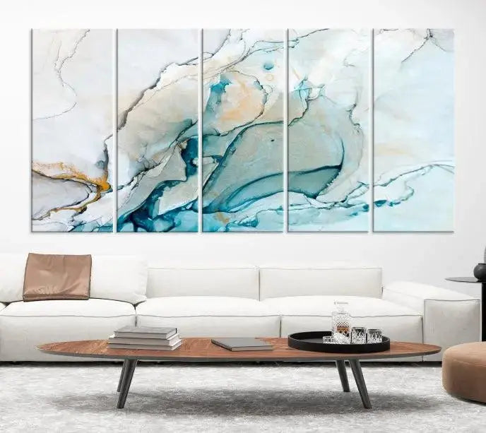 An abstract triptych of the Dark Turquoise Marble Fluid Effect on museum-quality canvas enhances the living room.