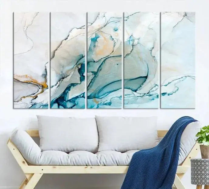 An abstract triptych of the Dark Turquoise Marble Fluid Effect on museum-quality canvas enhances the living room.