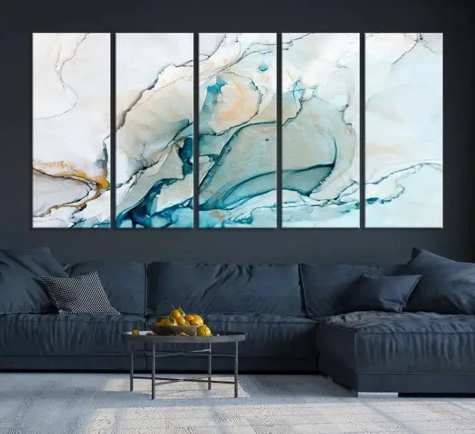 An abstract triptych of the Dark Turquoise Marble Fluid Effect on museum-quality canvas enhances the living room.