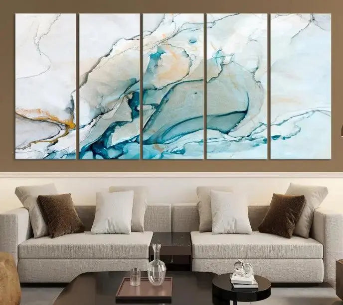 An abstract triptych of the Dark Turquoise Marble Fluid Effect on museum-quality canvas enhances the living room.