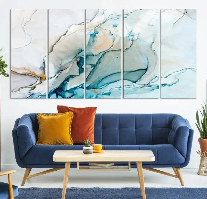 An abstract triptych of the Dark Turquoise Marble Fluid Effect on museum-quality canvas enhances the living room.