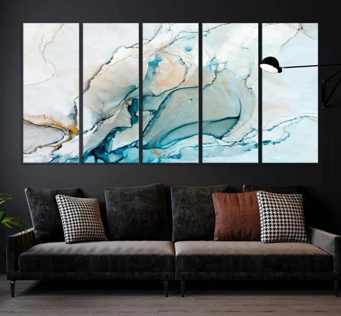 An abstract triptych of the Dark Turquoise Marble Fluid Effect on museum-quality canvas enhances the living room.