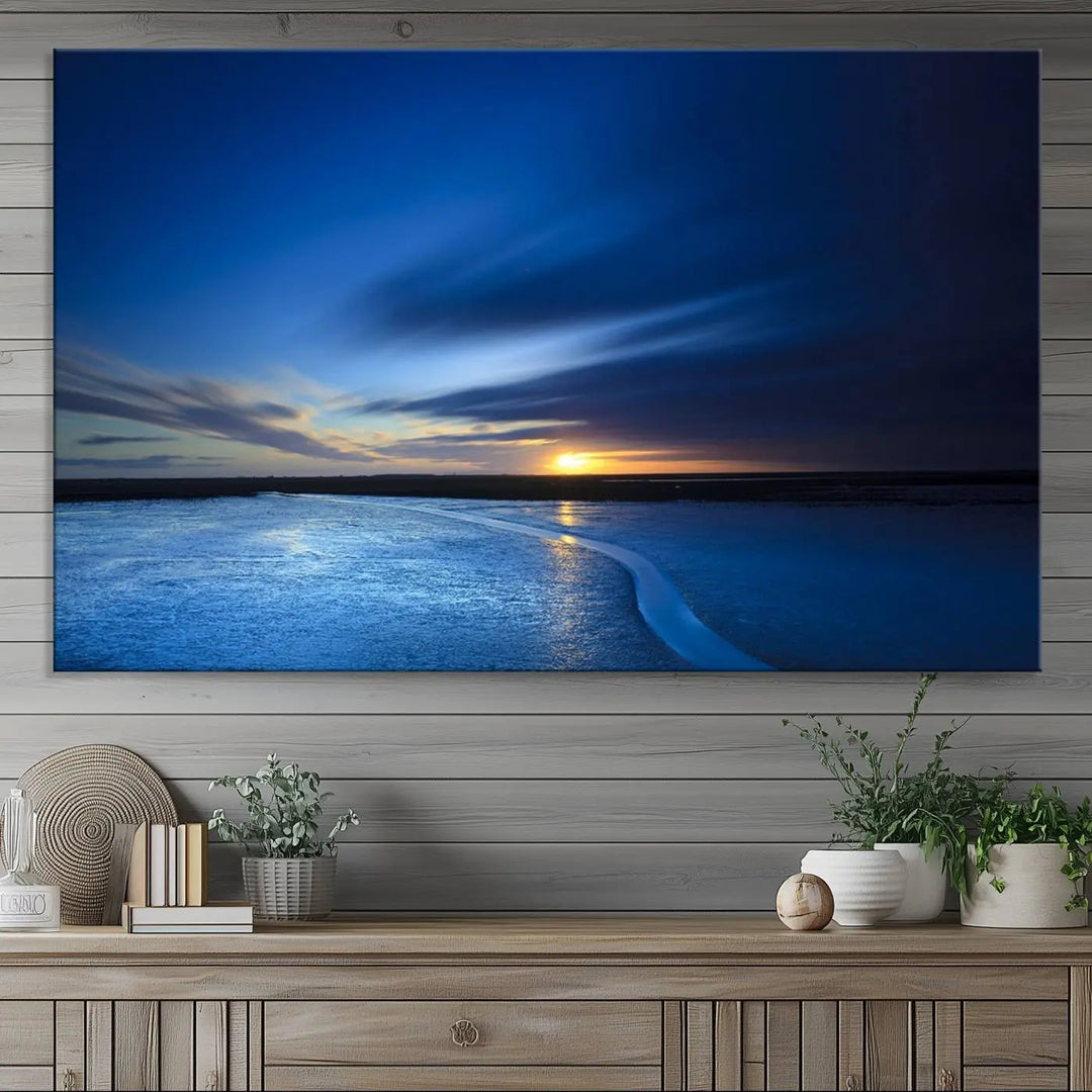 Deep blue ocean sunset triptych canvas art featuring a serene coastal sunset. Ideal for modern interiors. High-quality giclee canvas print.