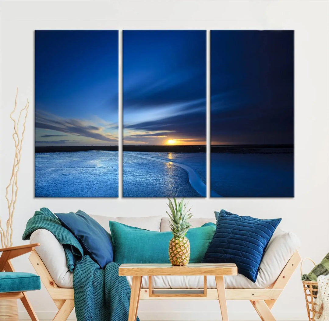 Deep blue ocean sunset triptych canvas art featuring a serene coastal sunset. Ideal for modern interiors. High-quality giclee canvas print.