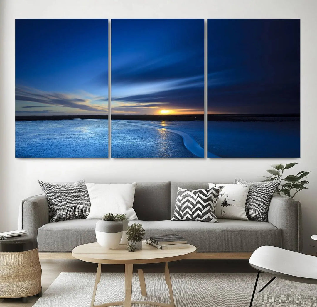 Deep blue ocean sunset triptych canvas art featuring a serene coastal sunset. Ideal for modern interiors. High-quality giclee canvas print.