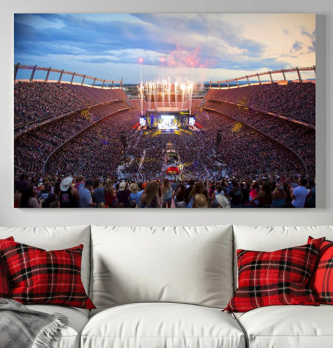 The Denver Broncos Football Team Print of Empower Field at Mile High Stadium adorns the wall, capturing a vibrant concert scene in a packed stadium at sunset with fireworks bursting above. This premium canvas offers an exquisite gallery-quality finish that perfectly complements the lively atmosphere.