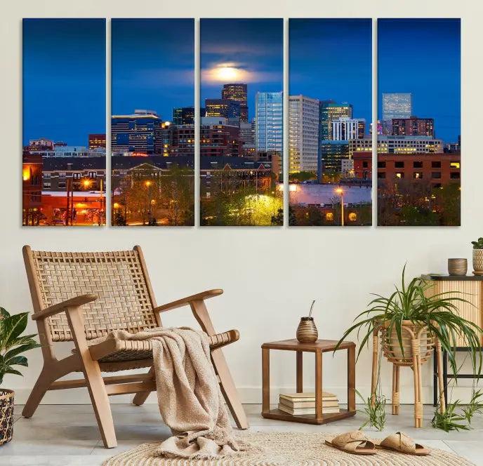 The Denver City Lights Night Blue Skyline Cityscape View Wall Art Canvas Print captures a stunning skyline at night with illuminated buildings and a bright moon, presented on gallery-quality canvas for an elegant display.