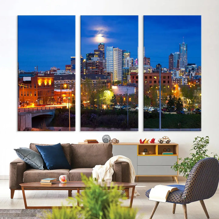 The Denver City Lights Night Blue Skyline Cityscape View Wall Art Canvas Print showcases a stunning night cityscape. Printed on museum-quality canvas with a UV-protective coating, this artwork comes ready to hang, adding an effortless touch of elegance.