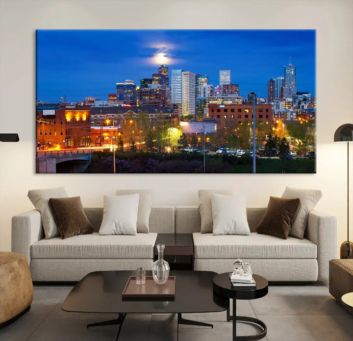 The Denver City Lights Night Blue Skyline Cityscape View Wall Art Canvas Print showcases a stunning night cityscape. Printed on museum-quality canvas with a UV-protective coating, this artwork comes ready to hang, adding an effortless touch of elegance.