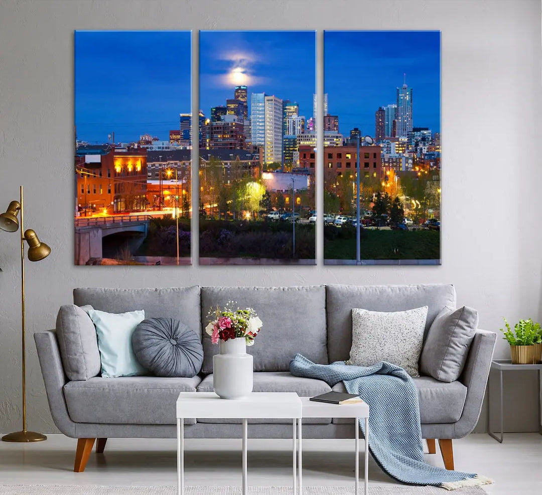 The Denver City Lights Night Blue Skyline Cityscape View Wall Art Canvas Print showcases a stunning night cityscape. Printed on museum-quality canvas with a UV-protective coating, this artwork comes ready to hang, adding an effortless touch of elegance.