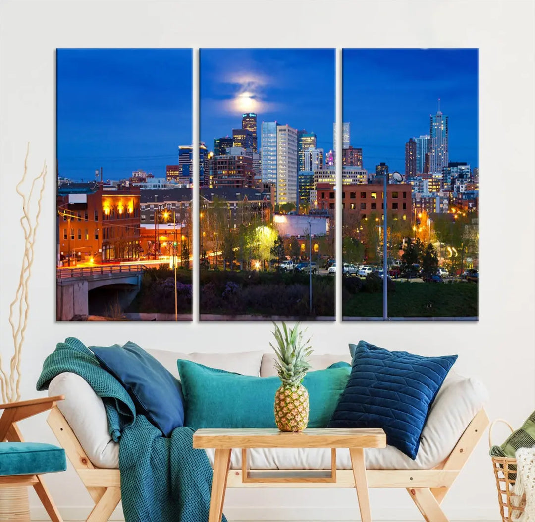 The Denver City Lights Night Blue Skyline Cityscape View Wall Art Canvas Print showcases a stunning night cityscape. Printed on museum-quality canvas with a UV-protective coating, this artwork comes ready to hang, adding an effortless touch of elegance.